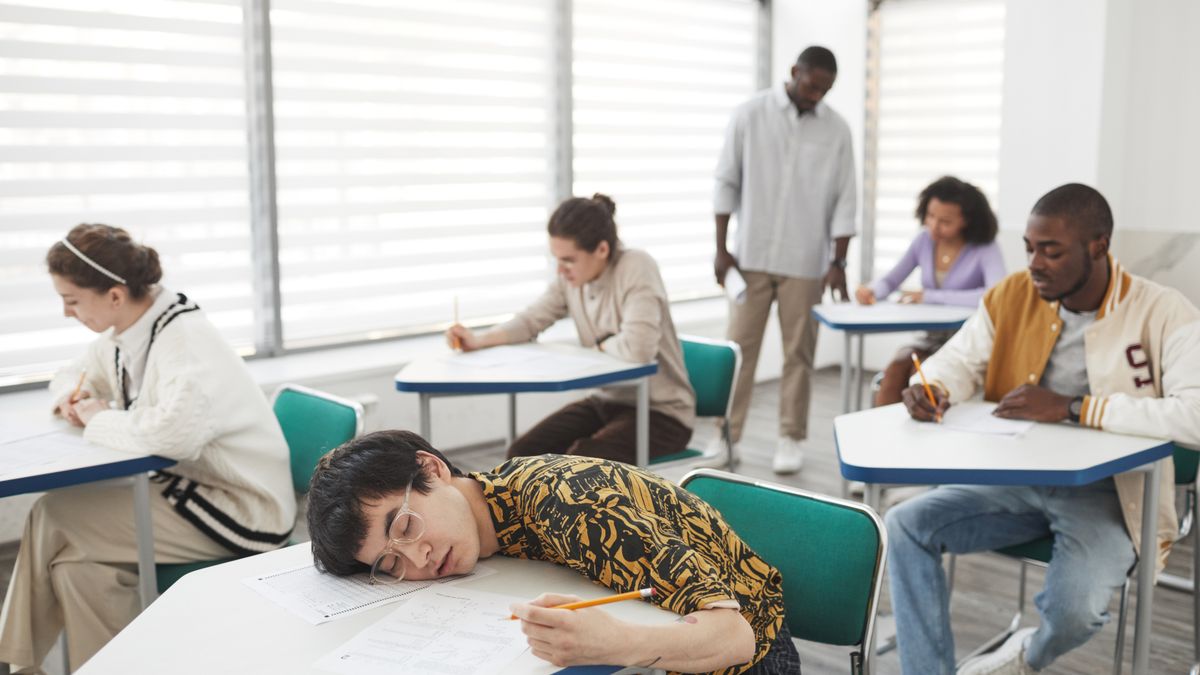 prospective recruit completing a timed practice test at a desk