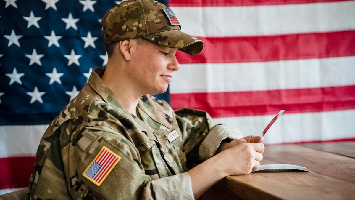 Service member reviewing medical records and separation paperwork at a desk