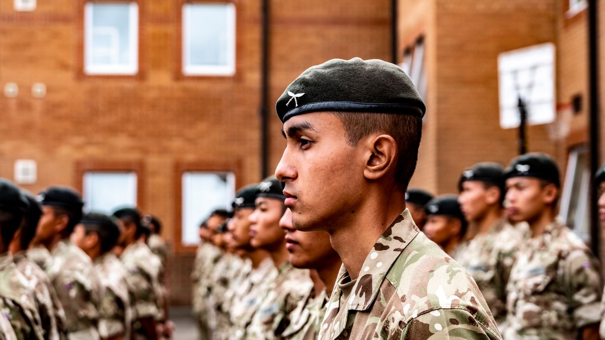 Recruits from different military branches training outdoors