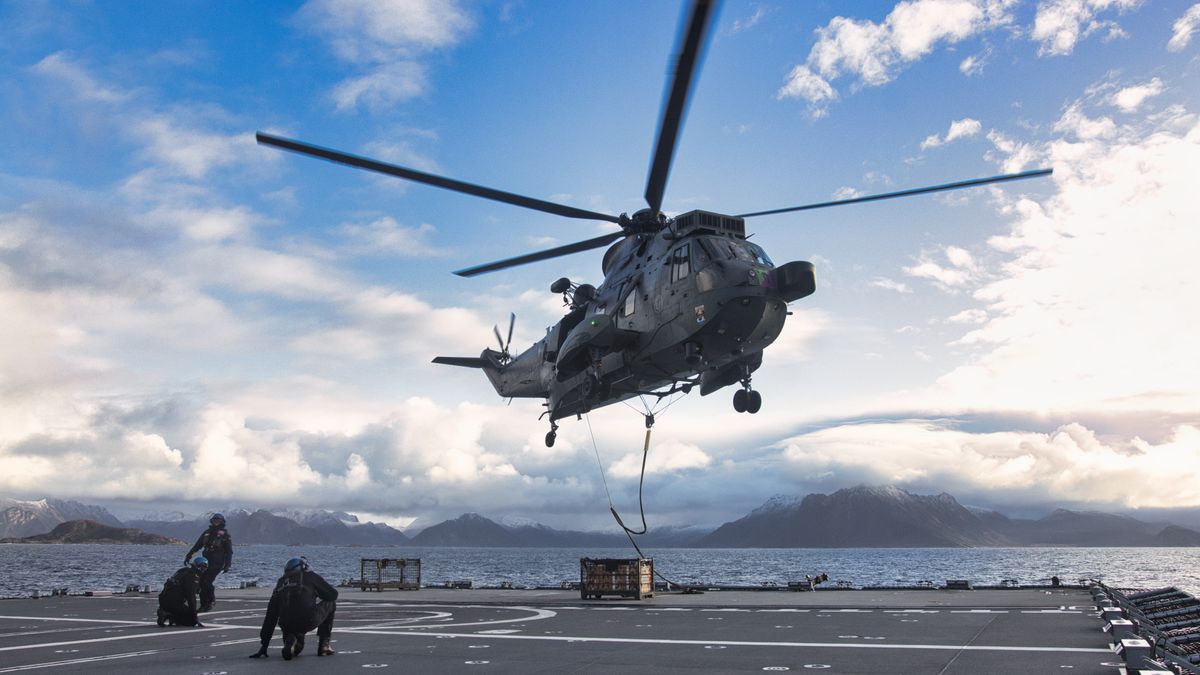 Sailors working together on the deck of a Navy ship