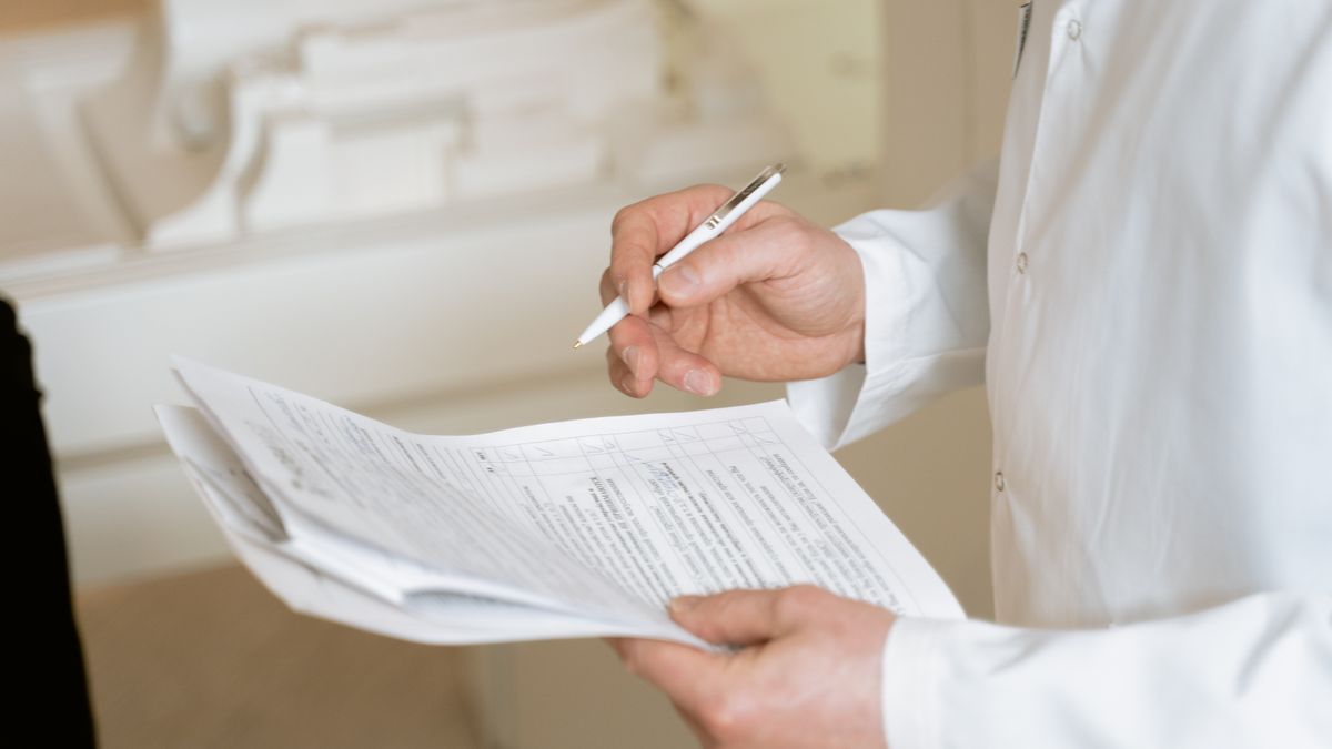 Military family reviewing medical forms with a health care provider