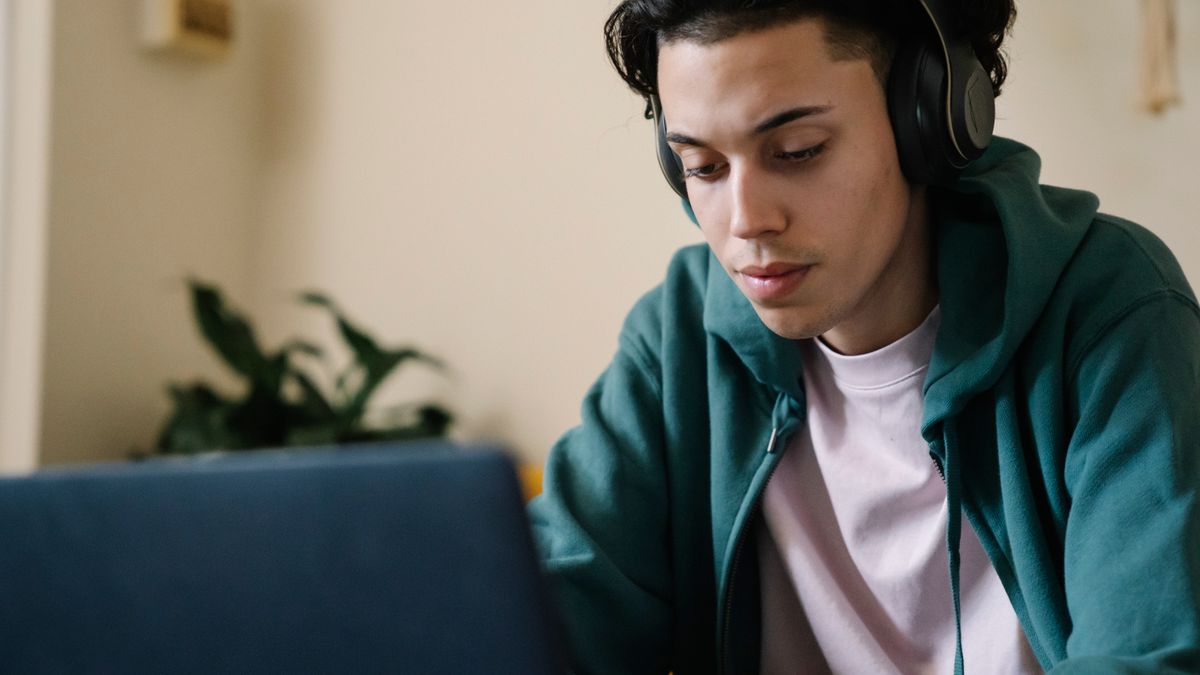 United States veteran student reviewing a college schedule on a laptop