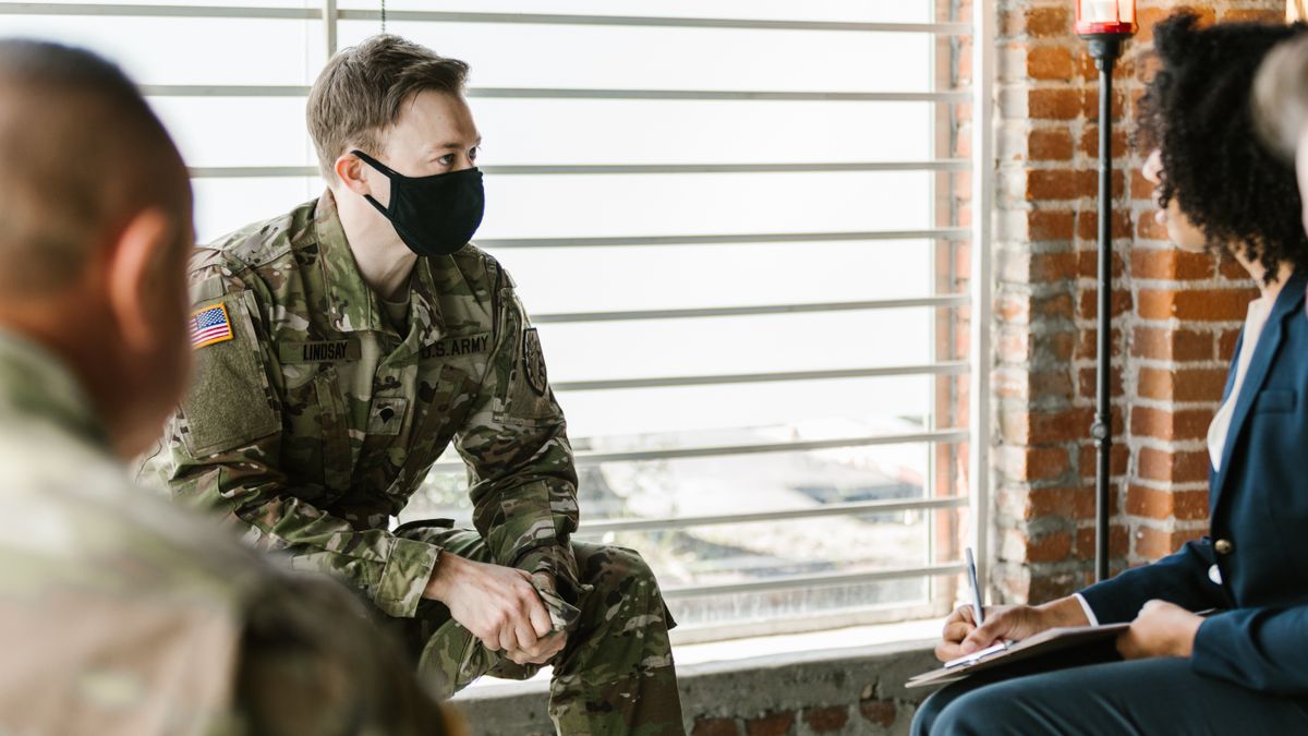US service member meeting with a security manager in an American military office