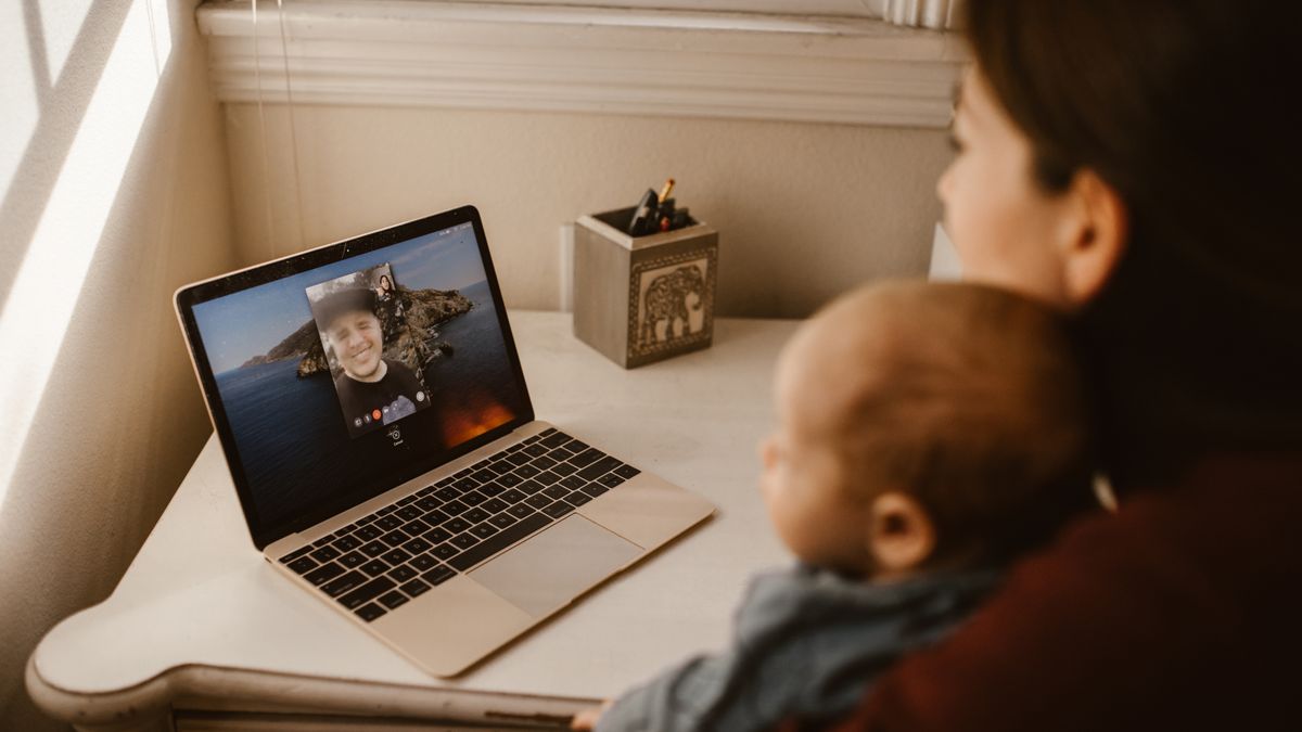 Military parent speaking with a child during a video call