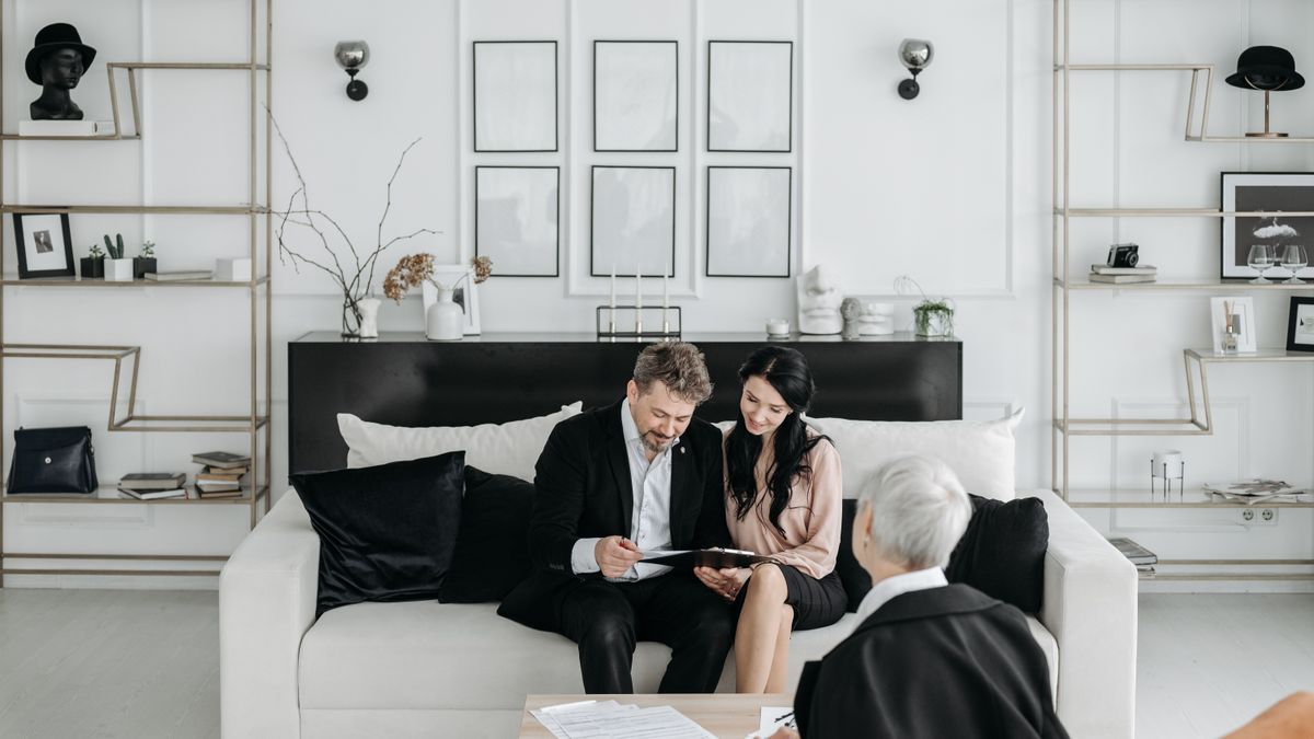 Active-duty member reviewing a military debt notice with a finance counselor