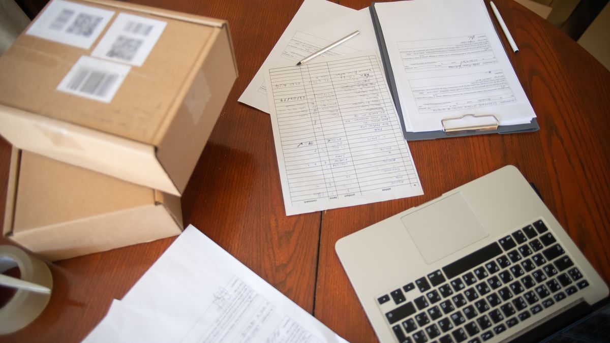 Veteran reviewing disability claim paperwork at a desk