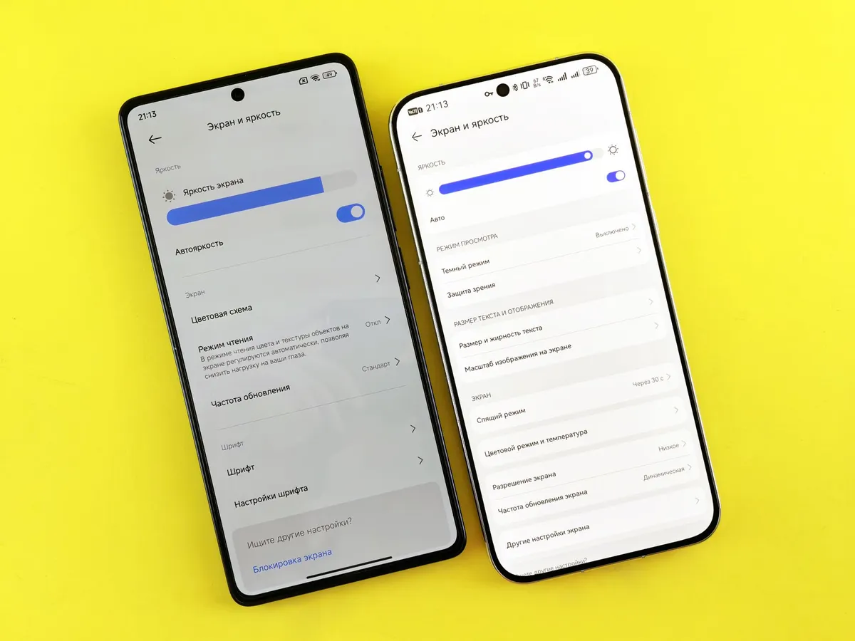 Two phones side by side on a table, one showing a carrier name and one showing emergency calls only