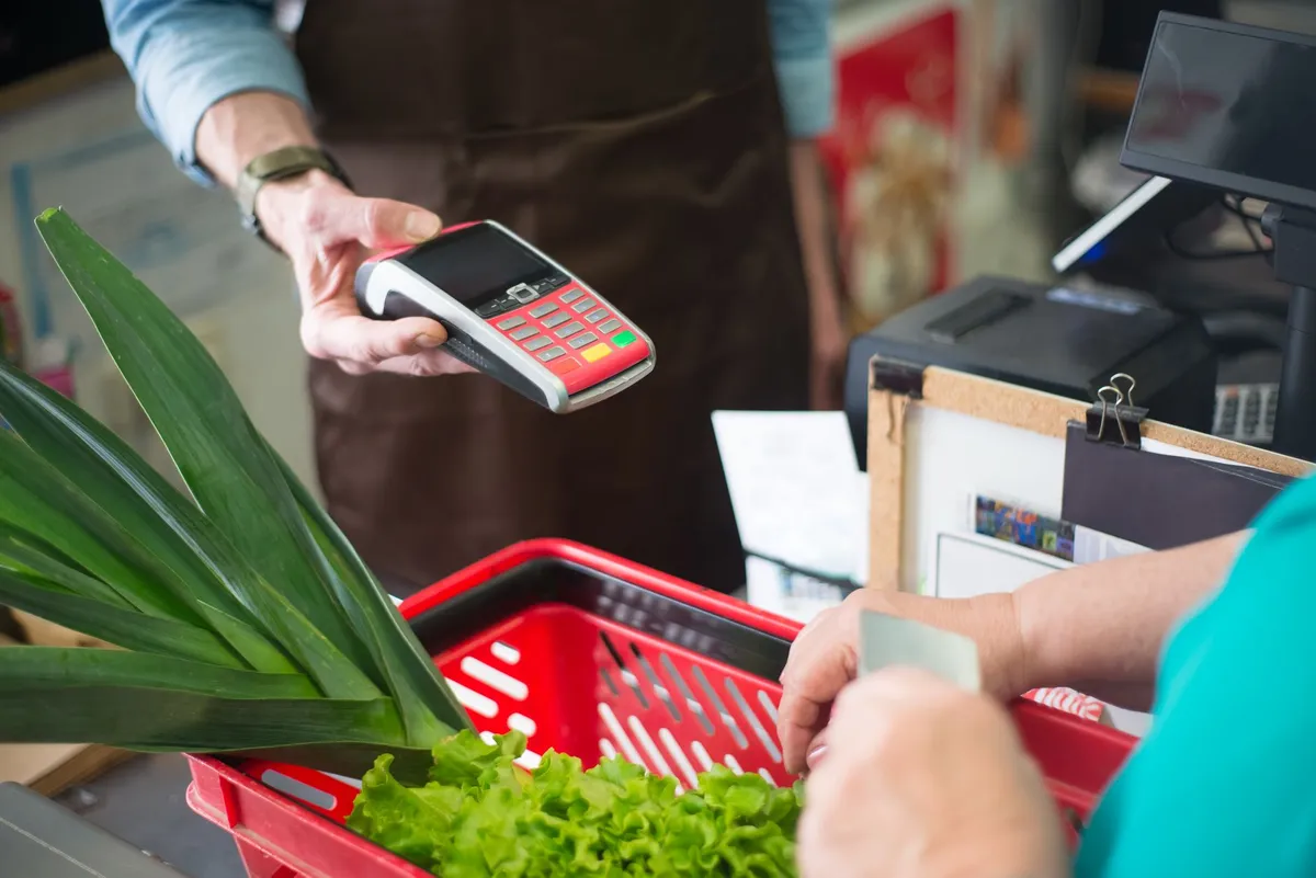 EBT payment card being used at a supermarket checkout terminal