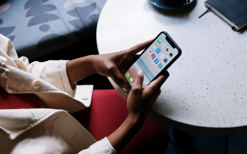 A person is checking if the free government iPhone legit program is real and trustworthy