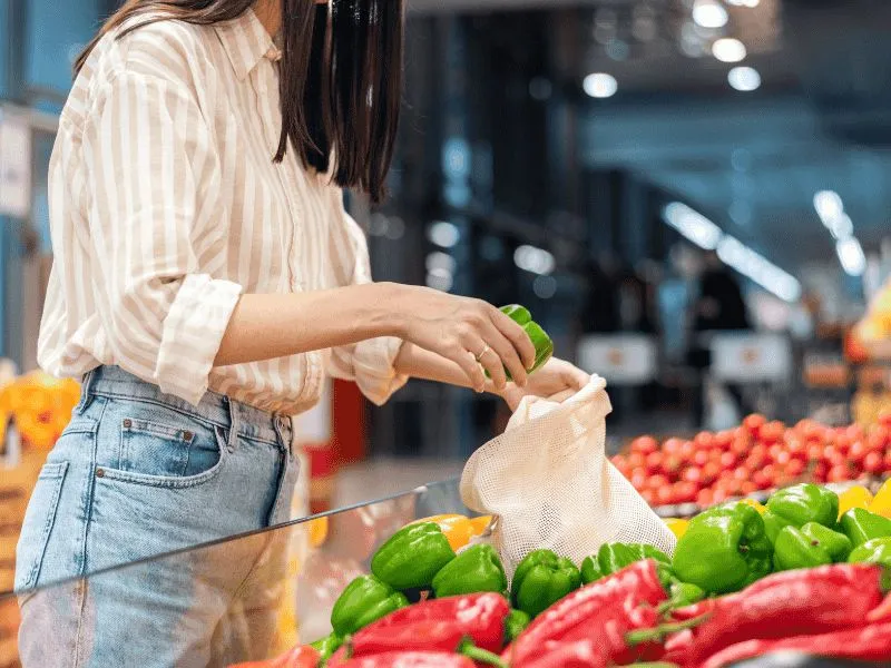 Person-shopping-produce-using-EBT-cash-benefits